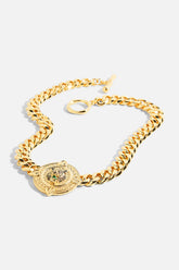 18k Gold plated CAMILLA Imperial Idol Jaggi Necklace with chunky chain, round pendant, and cubic zirconia accents.