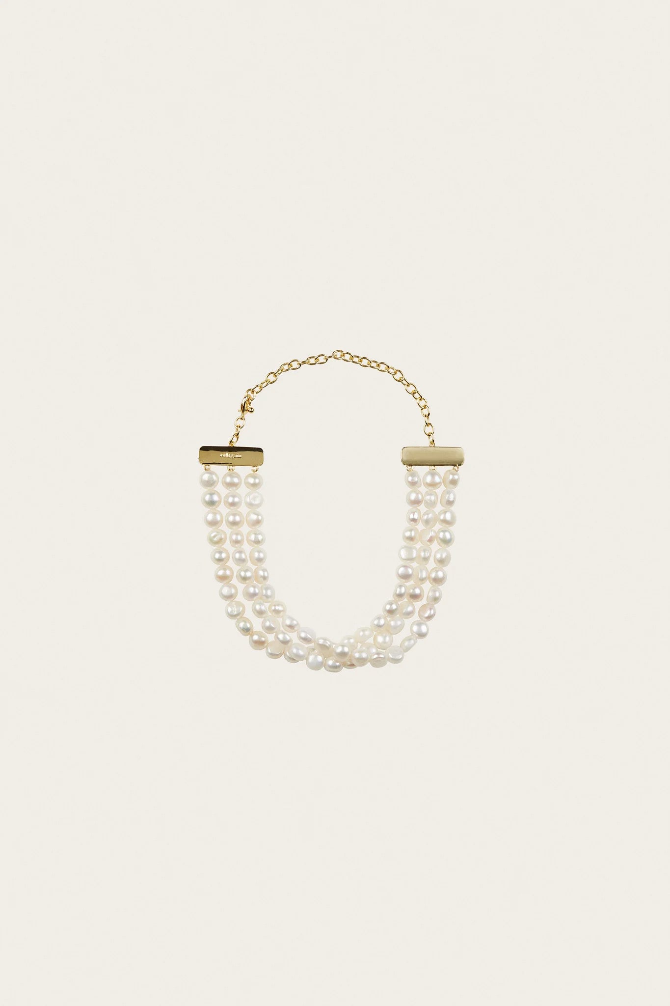 Cult Gaia Nora 3-row Keshi freshwater pearl choker necklace with brass lobster clasp closure on white background