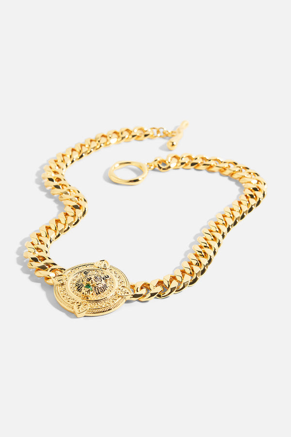 18k Gold plated CAMILLA Imperial Idol Jaggi Necklace with chunky chain, round pendant, and cubic zirconia accents.
