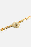 Close up of CAMILLA gold-plated Jaggi Necklace with signature lion-inspired pendant and bold statement chain. 